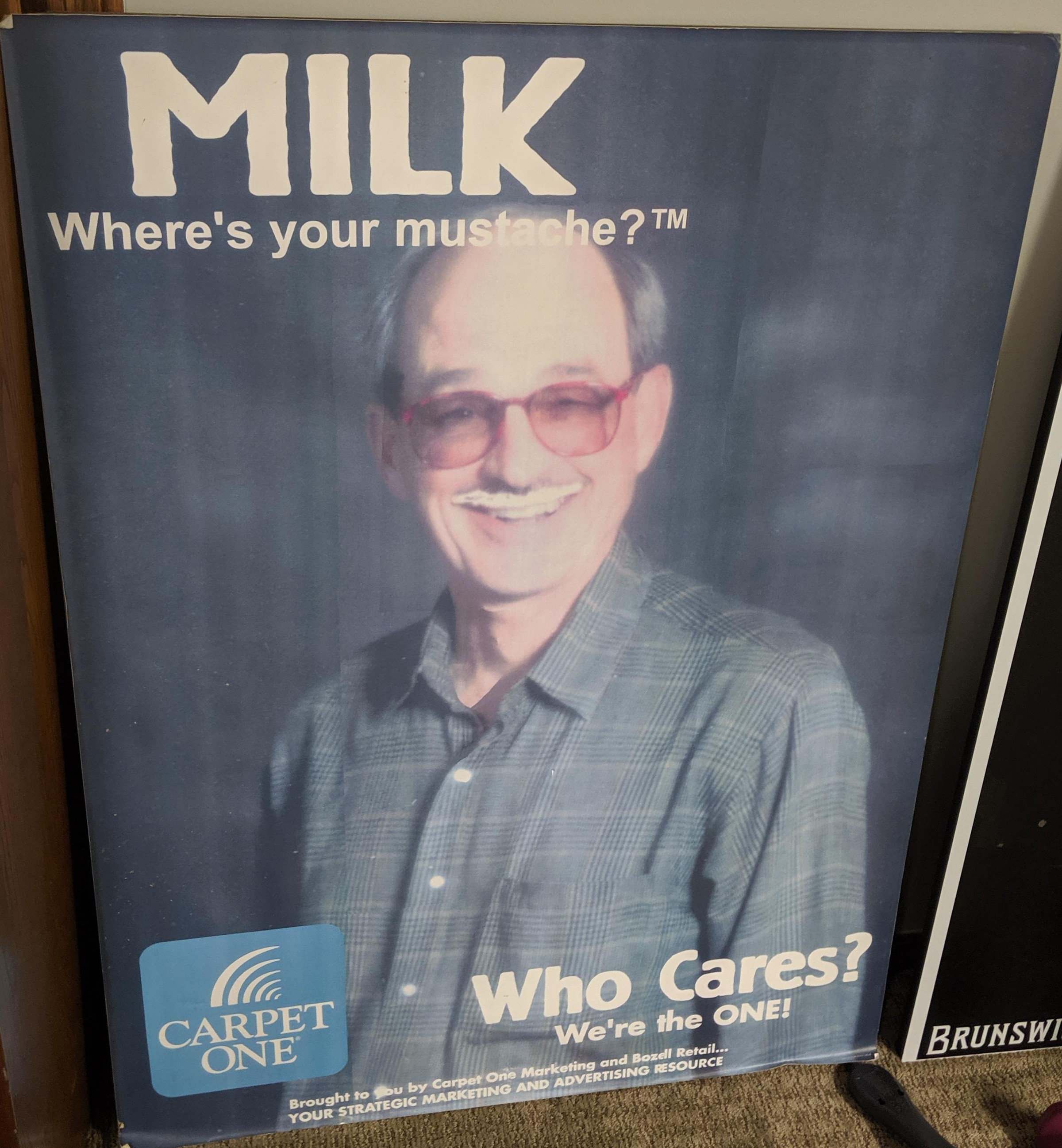 Carpet One “MILK. Where’s your mustache?” poster — “Who Cares? We’re the ONE!”