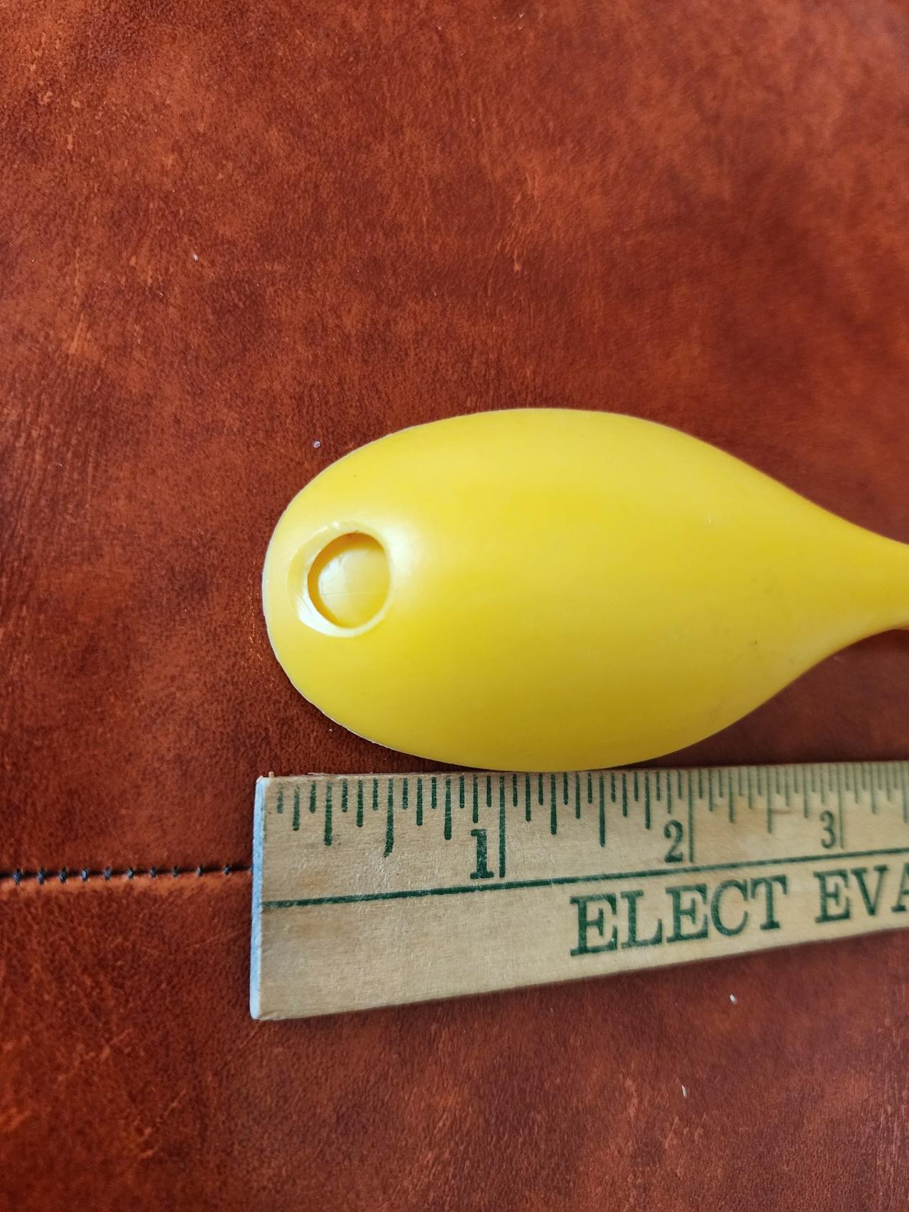Drinking opening on the underside of the spoon