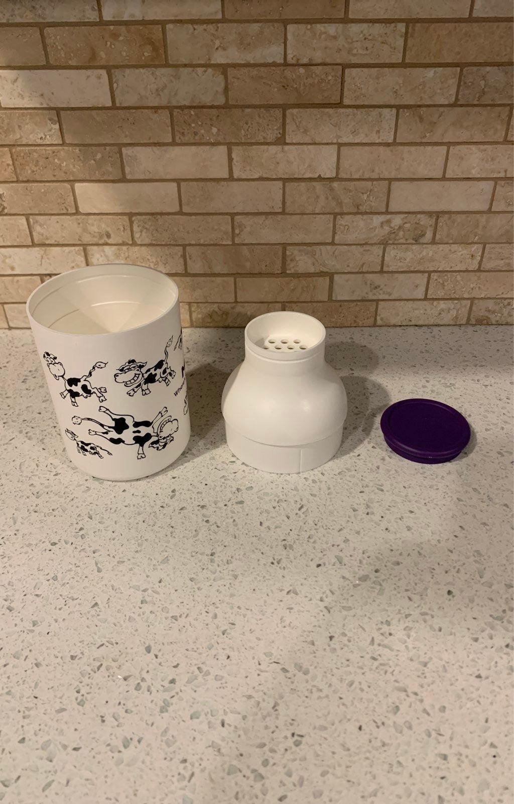 The three parts: cup, strainer top and lid